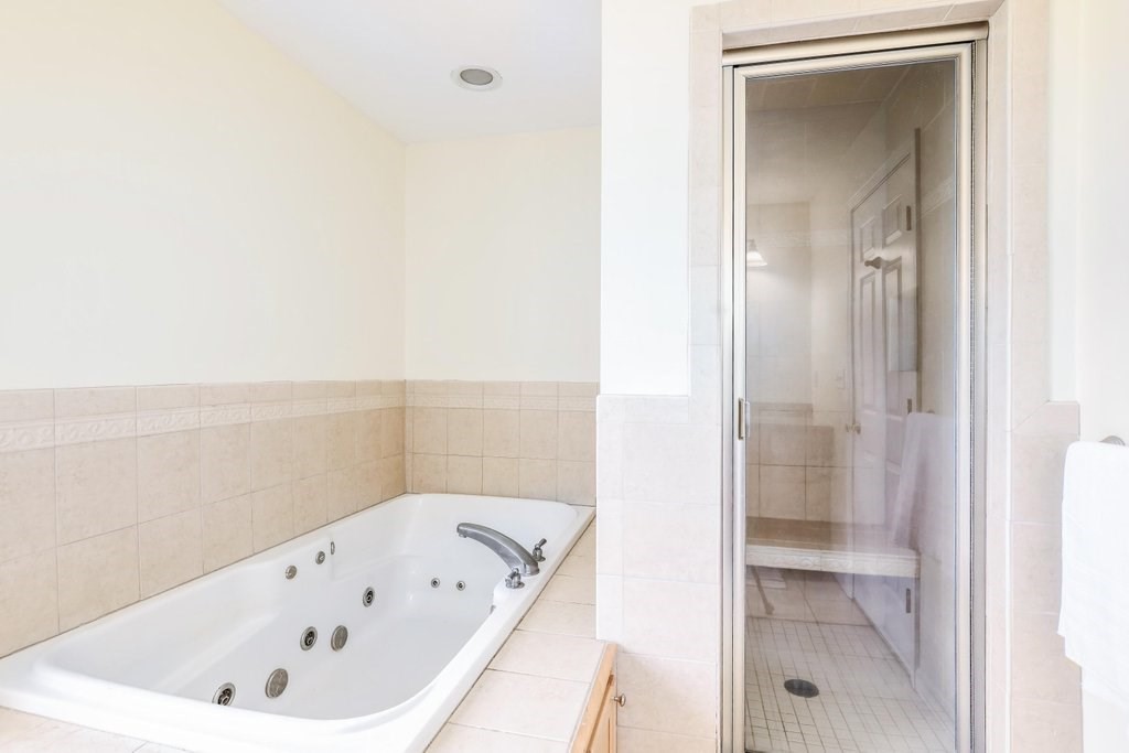 53 Baker Pond Road Charlton, MA 01507 - Photo 25 of 27 a bathroom with a bathtub