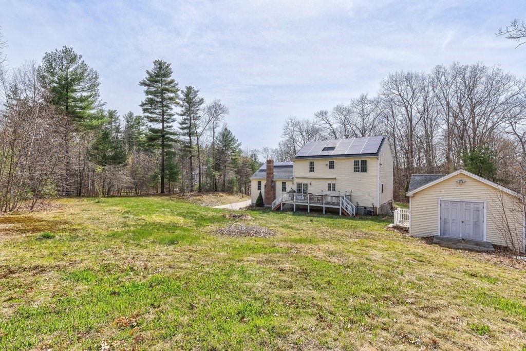 53 Baker Pond Road Charlton, MA 01507 - Photo 5 of 27 a house view with a garden space