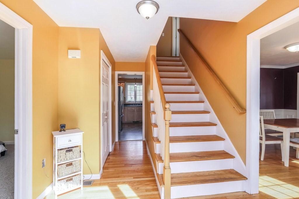 53 Baker Pond Road Charlton, MA 01507 - Photo 8 of 27 a view of a hallway with wooden floor and entryway