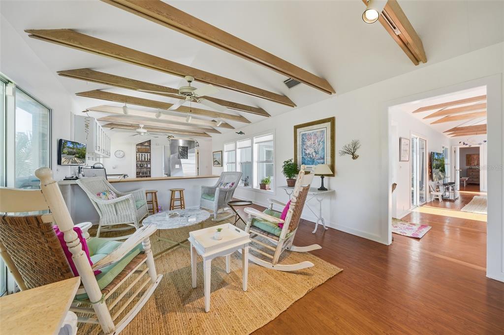 700 Lands End Drive Longboat Key, FL 34228 - Photo 13 of 70 a living room with furniture and wooden floor