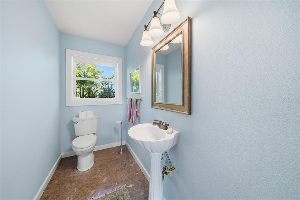 700 Lands End Drive Longboat Key, FL 34228 - Photo 20 of 70 a bathroom with a sink toilet and a mirror