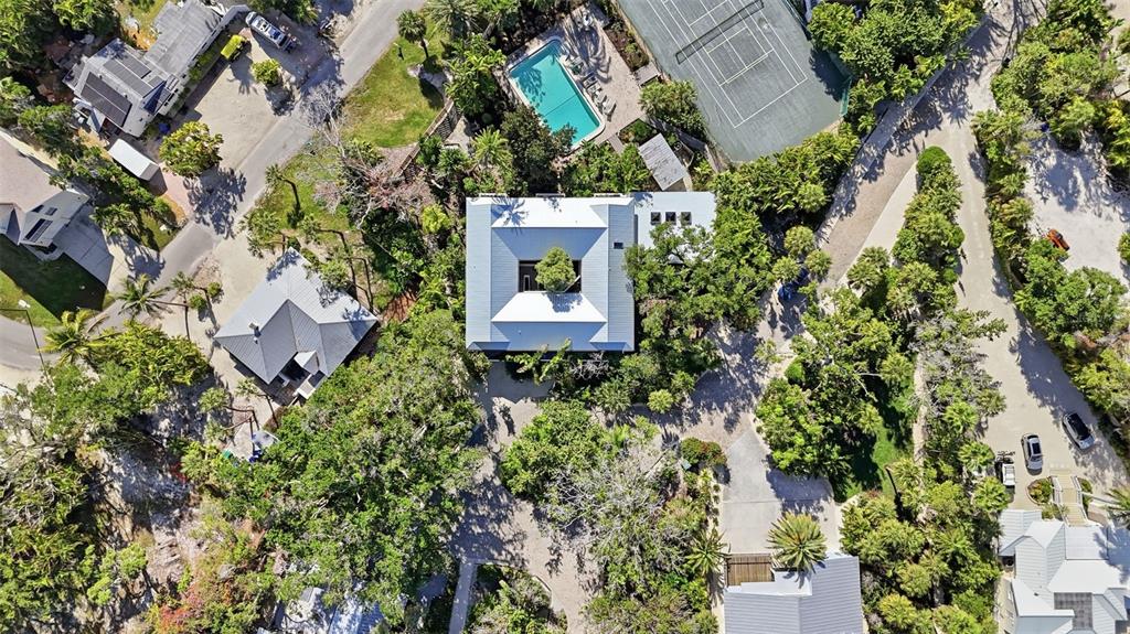 700 Lands End Drive Longboat Key, FL 34228 - Photo 3 of 70 an aerial view of a house with a yard and garden