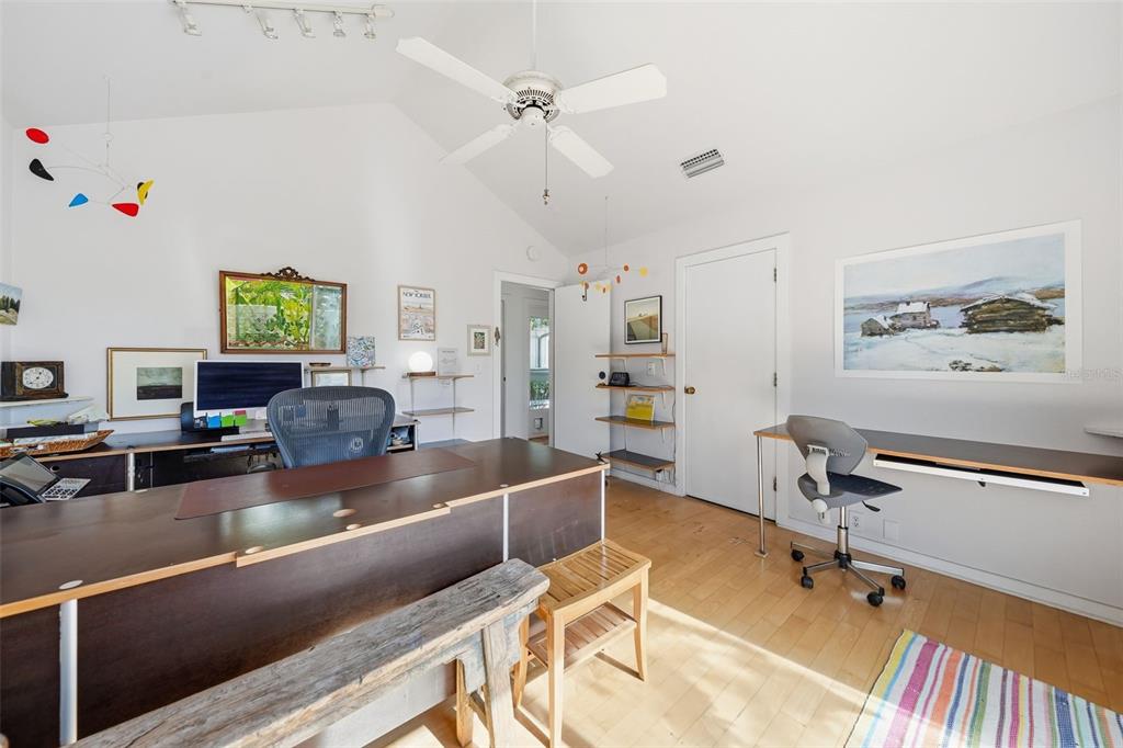 700 Lands End Drive Longboat Key, FL 34228 - Photo 34 of 70 a living room with furniture and a flat screen tv