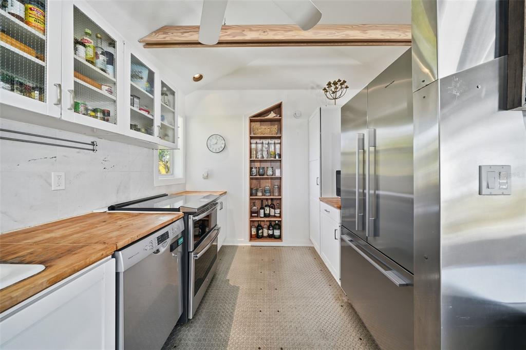 700 Lands End Drive Longboat Key, FL 34228 - Photo 5 of 70 a kitchen with stainless steel appliances granite countertop a refrigerator and a stove