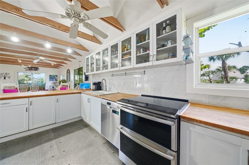 700 Lands End Drive Longboat Key, FL 34228 - Photo 6 of 70 a kitchen with a stove and a sink