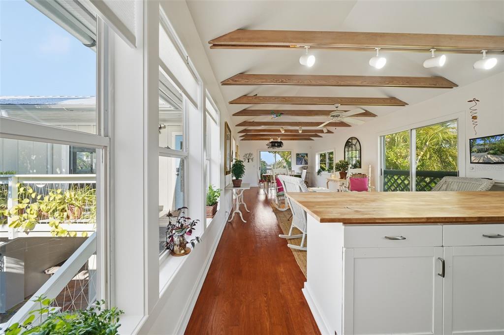 700 Lands End Drive Longboat Key, FL 34228 - Photo 10 of 70 a view of a kitchen with kitchen island and windows