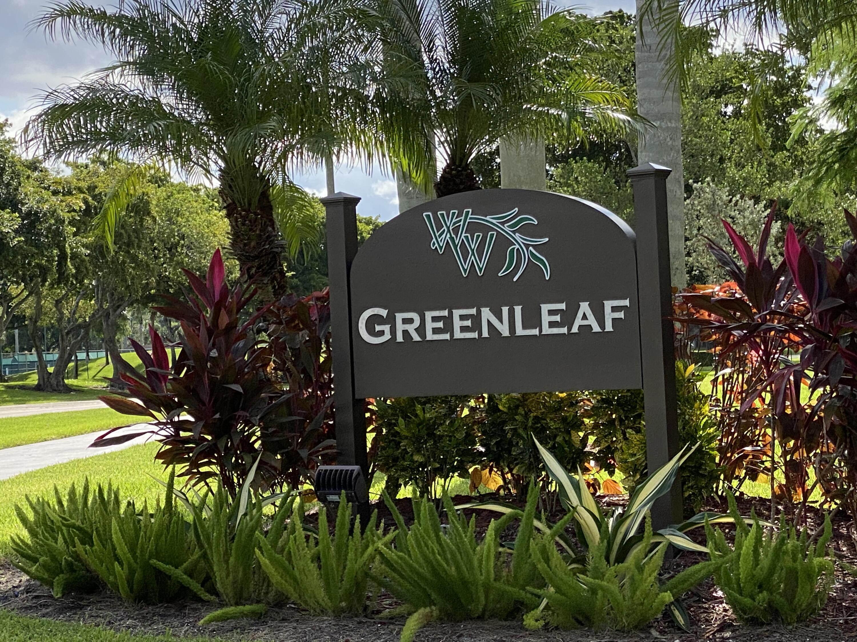 8936 Rheims Road Boca Raton, FL 33496 - Photo 24 of 42 a sign on a tree