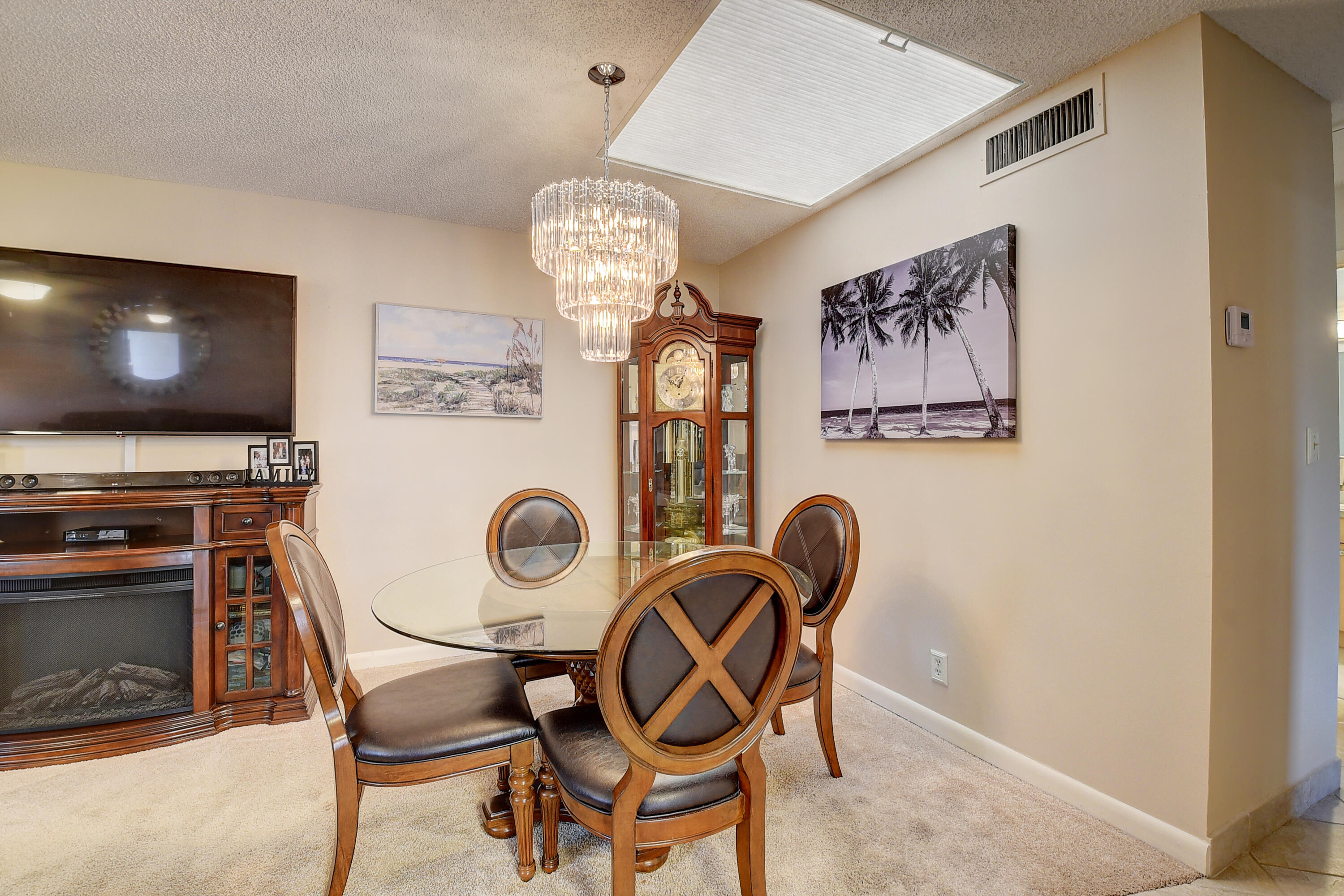 8936 Rheims Road Boca Raton, FL 33496 - Photo 6 of 42 a view of a dining room with furniture and chandelier