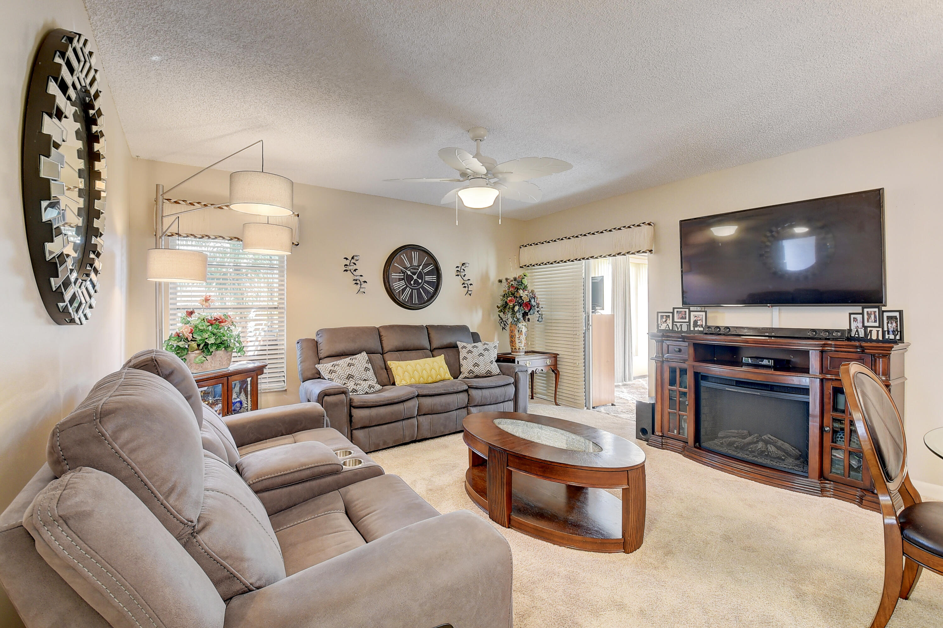 8936 Rheims Road Boca Raton, FL 33496 - Photo 8 of 42 a living room with furniture and a flat screen tv