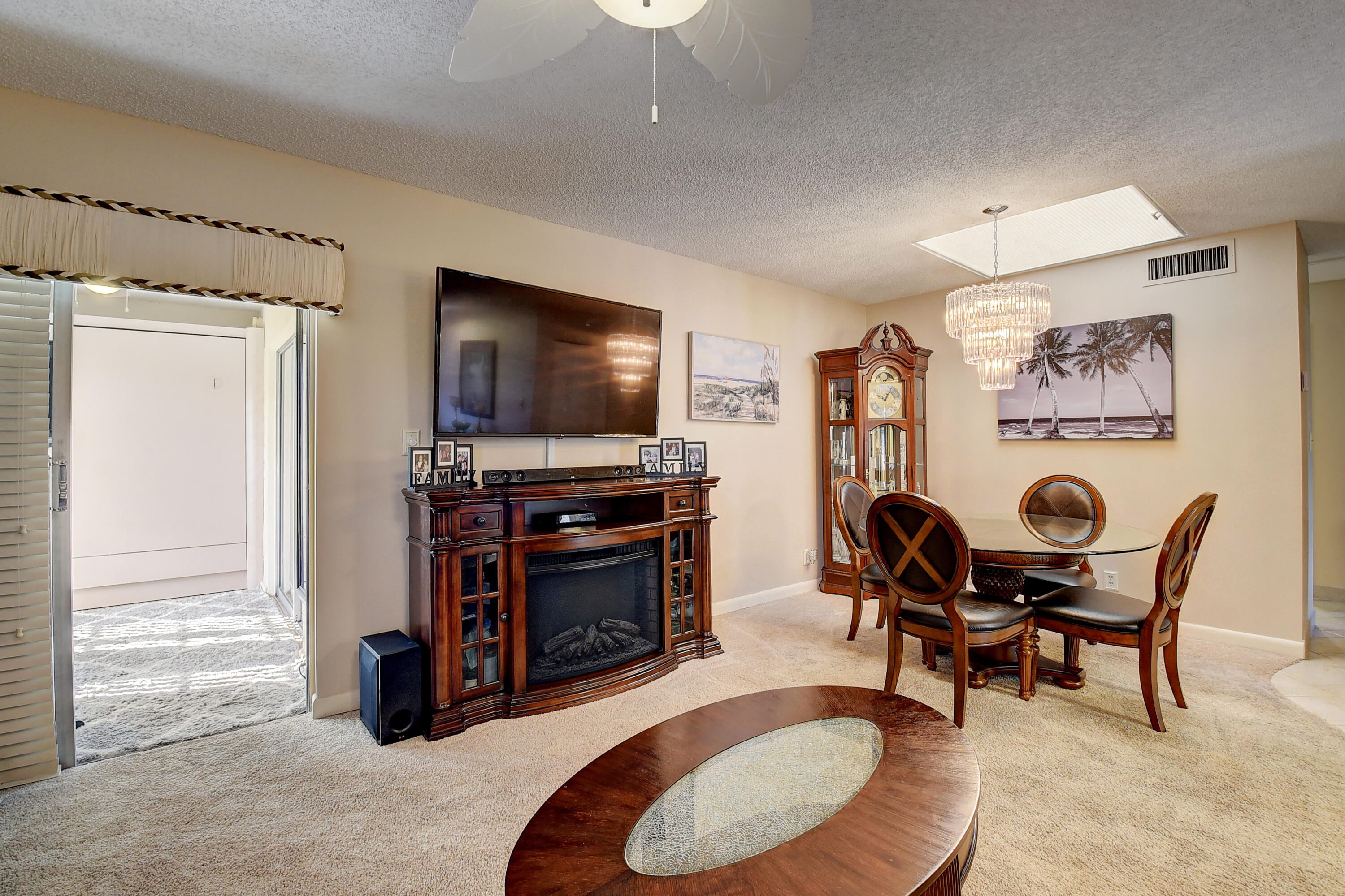8936 Rheims Road Boca Raton, FL 33496 - Photo 9 of 42 a living room with furniture and a flat screen tv