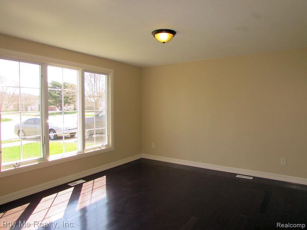 15814 Colbert Street Romulus, MI 48174 - Photo 3 of 21 12x14 Living room. Freshly painted interior. New vinyl windows. Prefinished hardwood flooring. Totally remodeled in 2011.