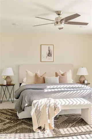 a bedroom with a bed and a couch