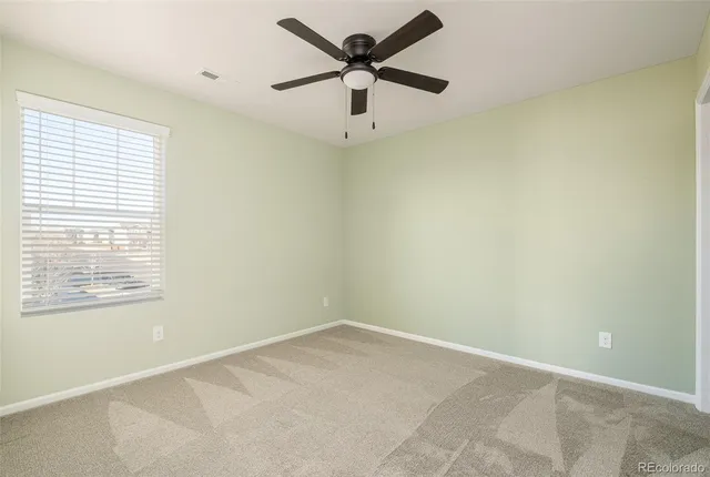 a bathroom with a double vanity sink toilet and a mirror