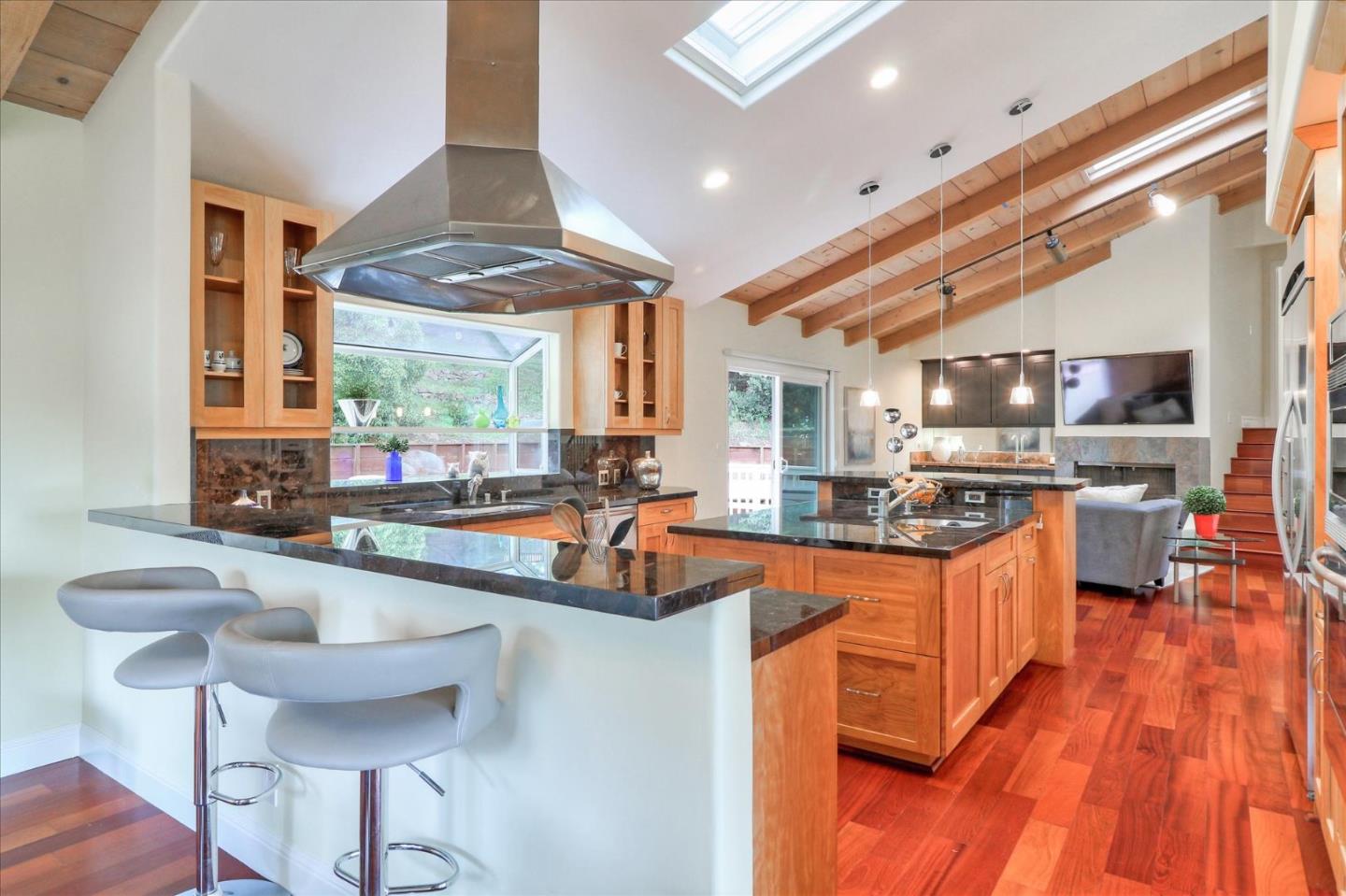 50 Tobin Clark Drive Hillsborough, CA 94010 - Photo 13 of 38 a kitchen with granite countertop a sink and a stove