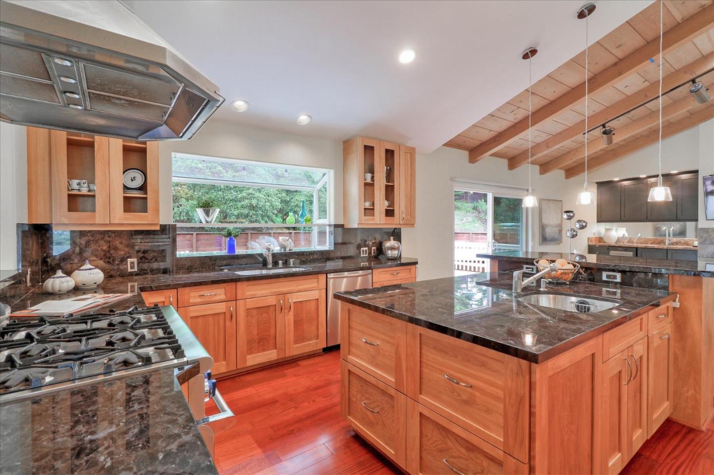 50 Tobin Clark Drive Hillsborough, CA 94010 - Photo 14 of 38 a kitchen with stainless steel appliances granite countertop a sink stove and cabinets