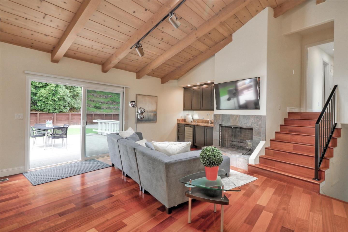 50 Tobin Clark Drive Hillsborough, CA 94010 - Photo 16 of 38 a living room with fireplace furniture and a wooden floor