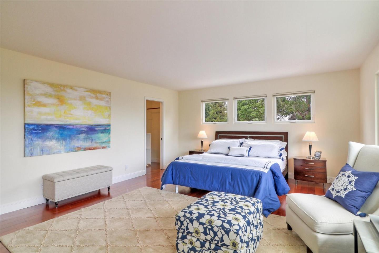 50 Tobin Clark Drive Hillsborough, CA 94010 - Photo 19 of 38 a bedroom with furniture and a window