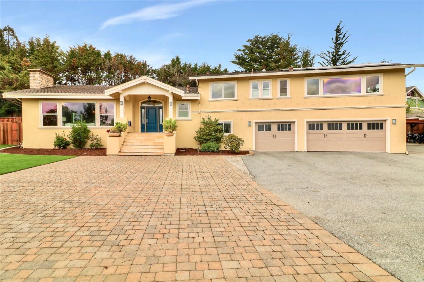 50 Tobin Clark Drive Hillsborough, CA 94010 - Photo 2 of 38 a front view of a house with a yard