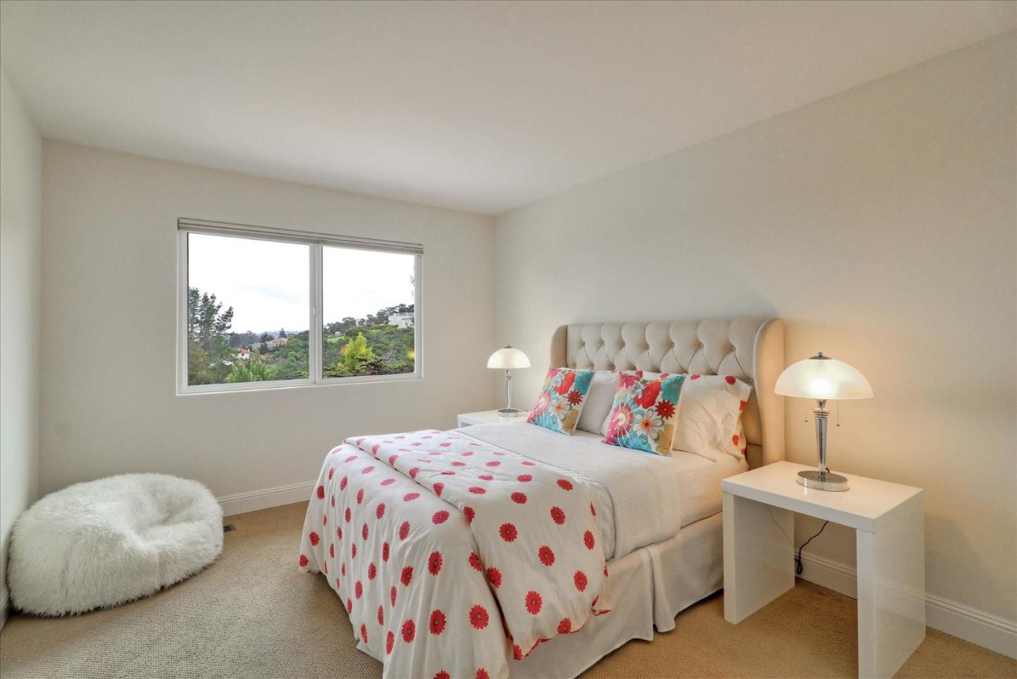 50 Tobin Clark Drive Hillsborough, CA 94010 - Photo 24 of 38 a bedroom with a bed and a lamp