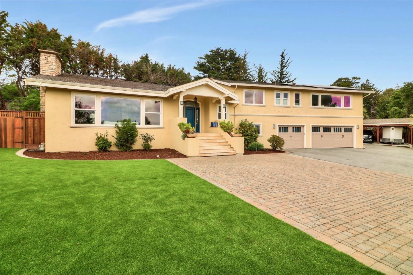 50 Tobin Clark Drive Hillsborough, CA 94010 - Photo 3 of 38 a front view of a house with a yard