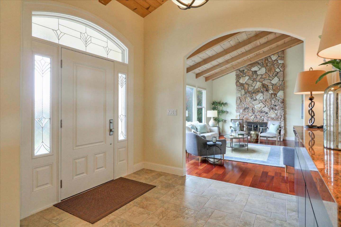 50 Tobin Clark Drive Hillsborough, CA 94010 - Photo 6 of 38 a living room with furniture and a chandelier