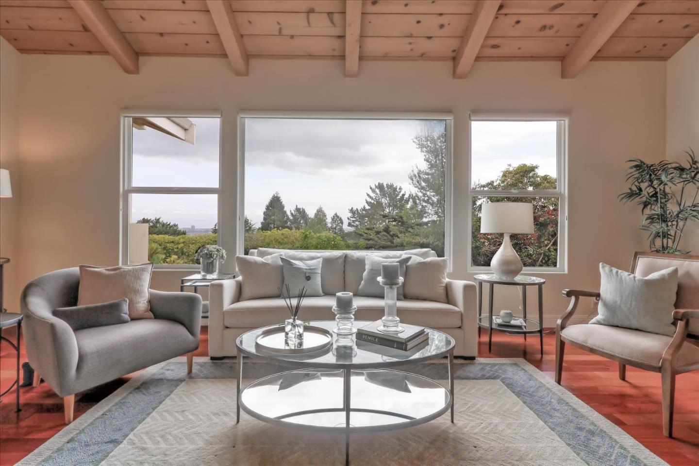 50 Tobin Clark Drive Hillsborough, CA 94010 - Photo 9 of 38 a living room with furniture and a large window