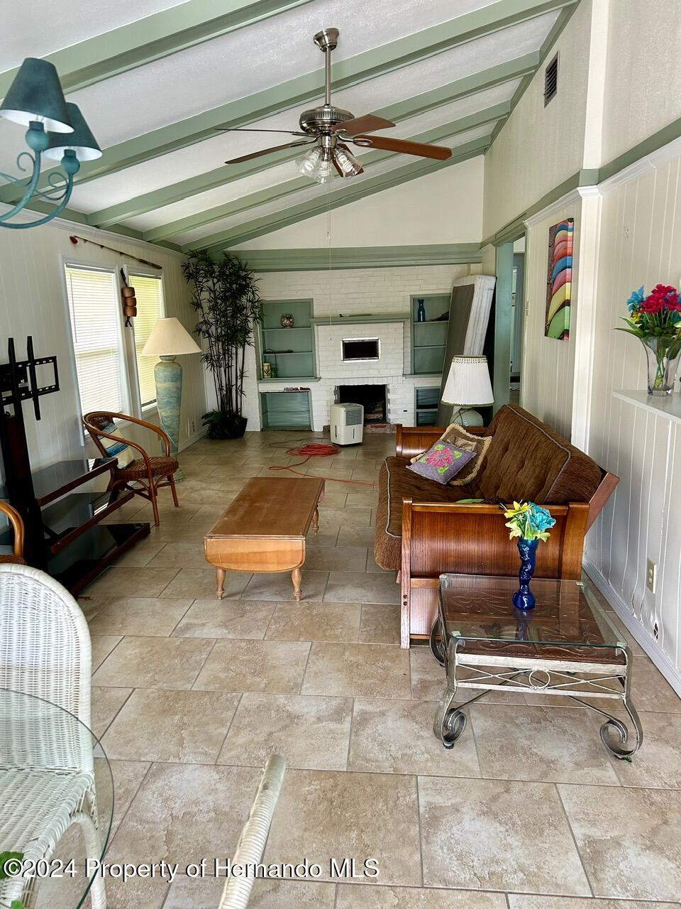 5332 Circle Drive Weeki Wachee, FL 34607 - Photo 18 of 27 a room with lots of furniture and a rug