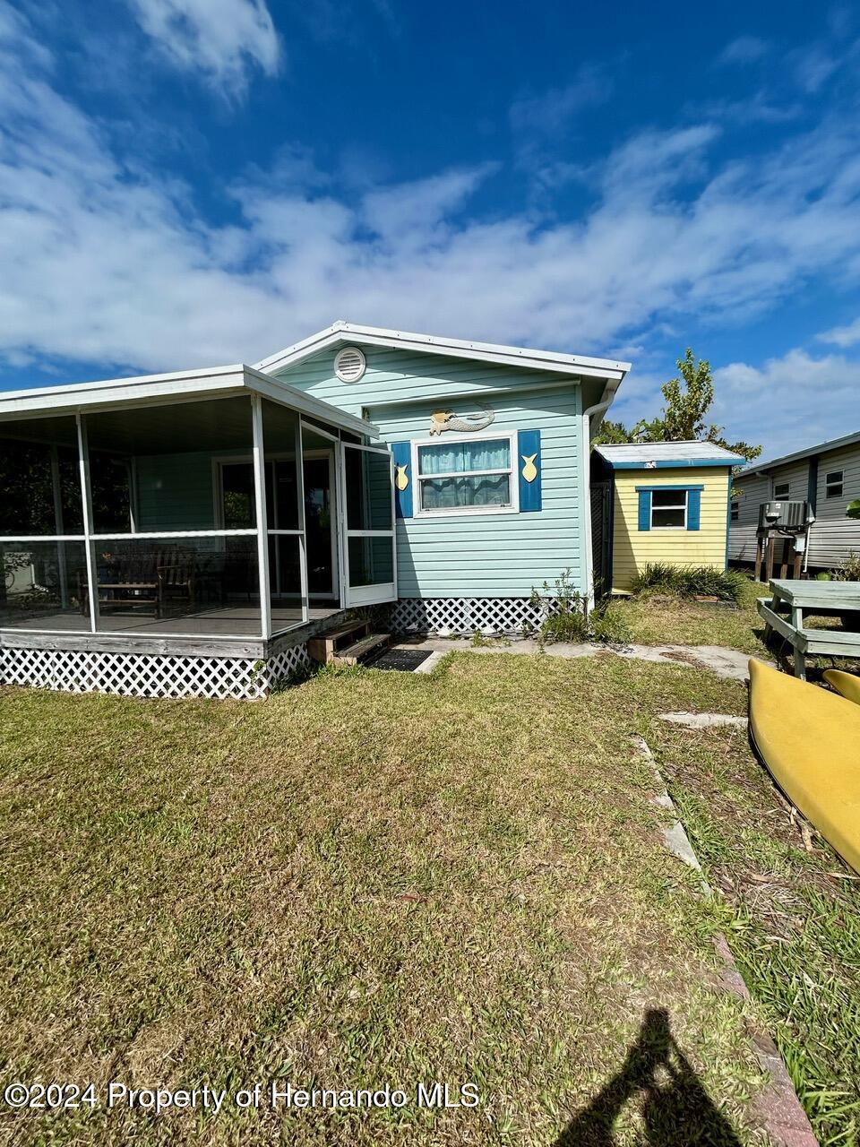 5332 Circle Drive Weeki Wachee, FL 34607 - Photo 6 of 27 a view of a house with a backyard
