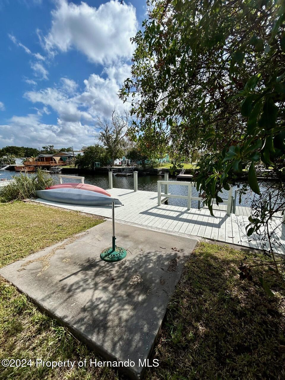 5332 Circle Drive Weeki Wachee, FL 34607 - Photo 7 of 27 a view of a swimming pool with an outdoor seating