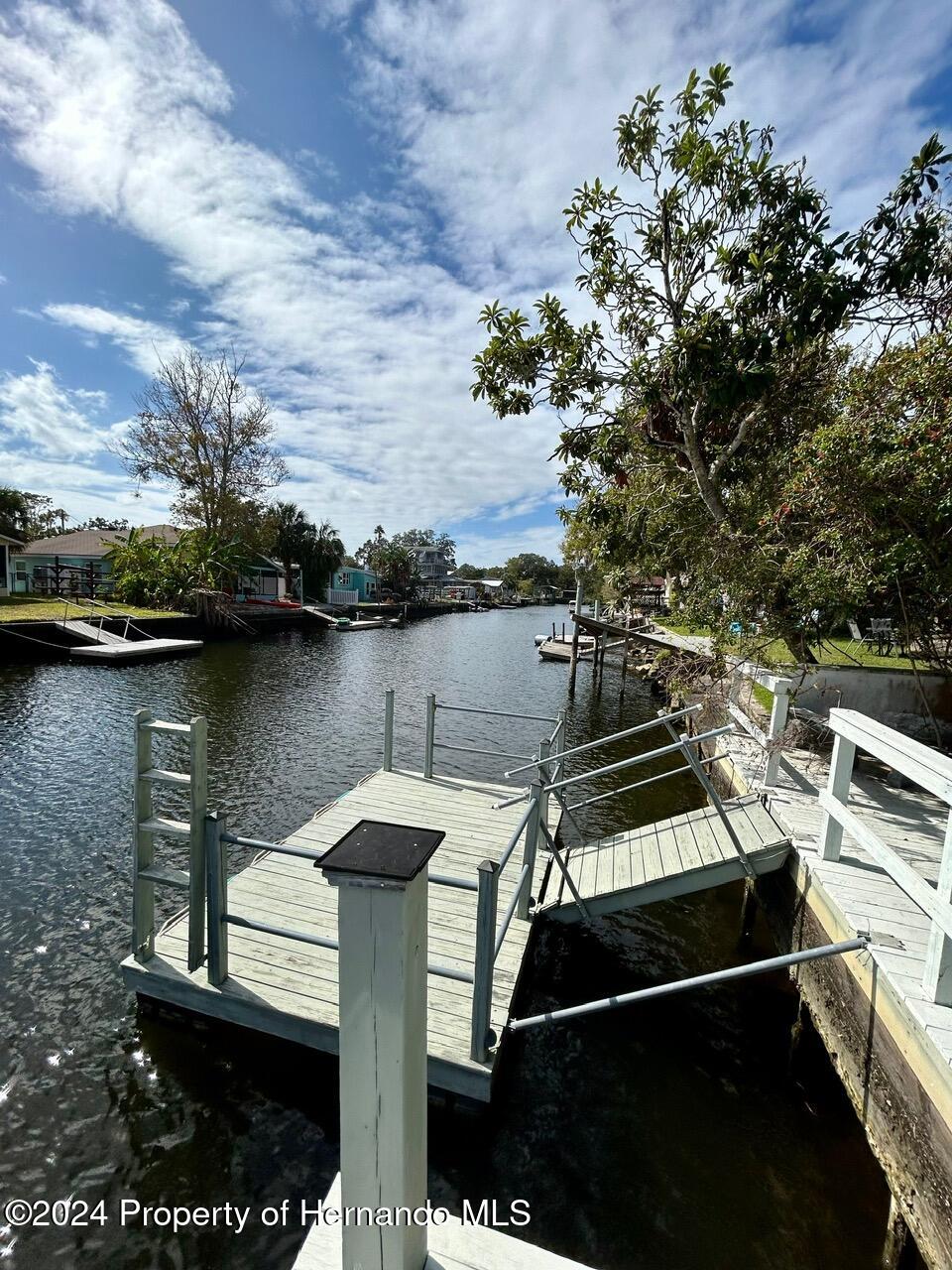 5332 Circle Drive Weeki Wachee, FL 34607 - Photo 10 of 27 a view of a lake with a terrace