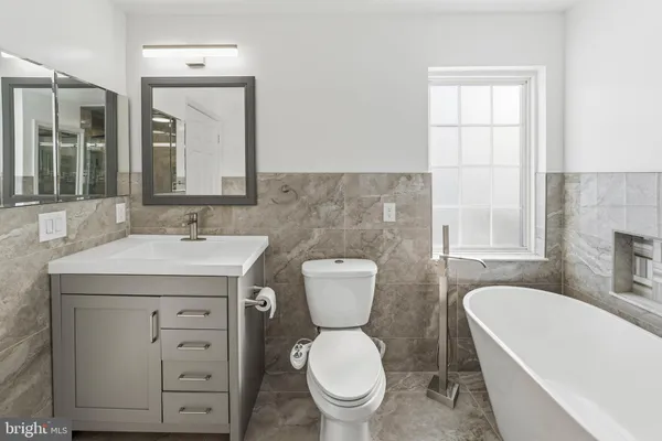 a bathroom with a bathtub and shower