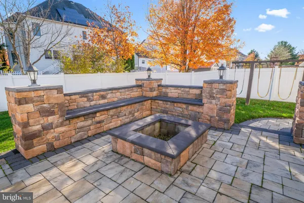 a view of a backyard with sitting area