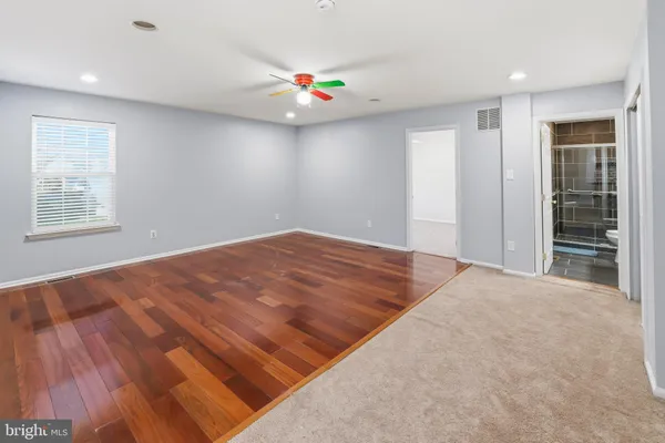 en view interior of a house with stairs and a ceiling fan
