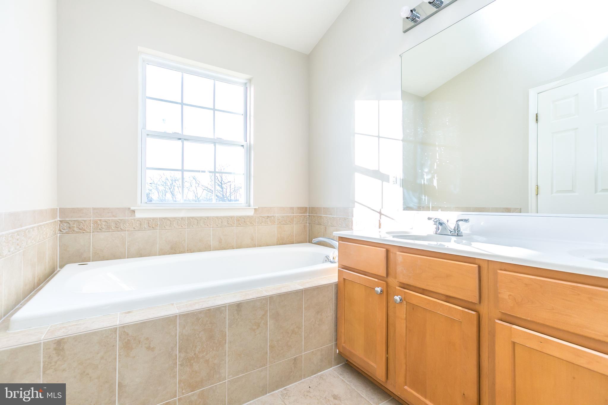 873 Middle River Road Middle River, MD 21220 - Photo 24 of 30 Master Bath with dual vanity and soaking tub
