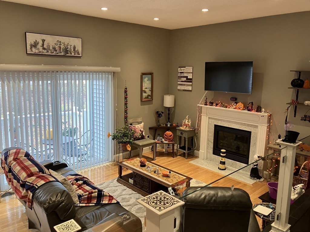 255 North Road, Unit 65 Chelmsford, MA 01824 - Photo 12 of 31 a bedroom with a bed and a flat screen tv