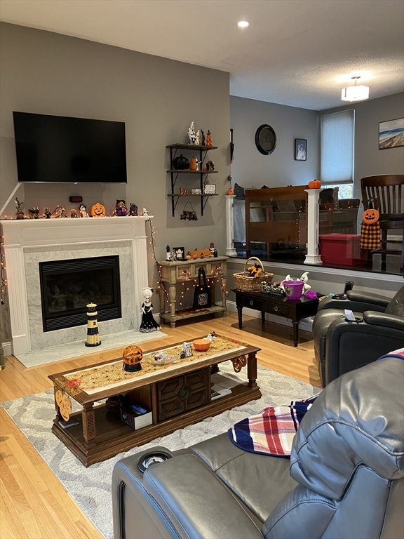 255 North Road, Unit 65 Chelmsford, MA 01824 - Photo 14 of 31 a living room with furniture and a flat screen tv