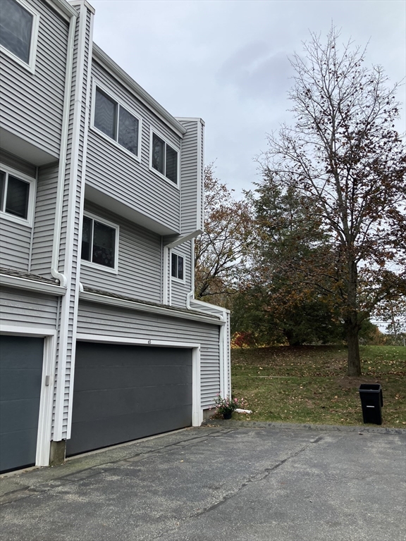 255 North Road, Unit 65 Chelmsford, MA 01824 - Photo 2 of 31 a front view of a house with lake