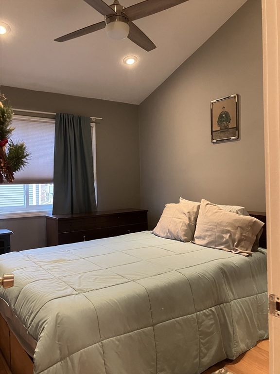 255 North Road, Unit 65 Chelmsford, MA 01824 - Photo 26 of 31 a bedroom with a large bed and a window