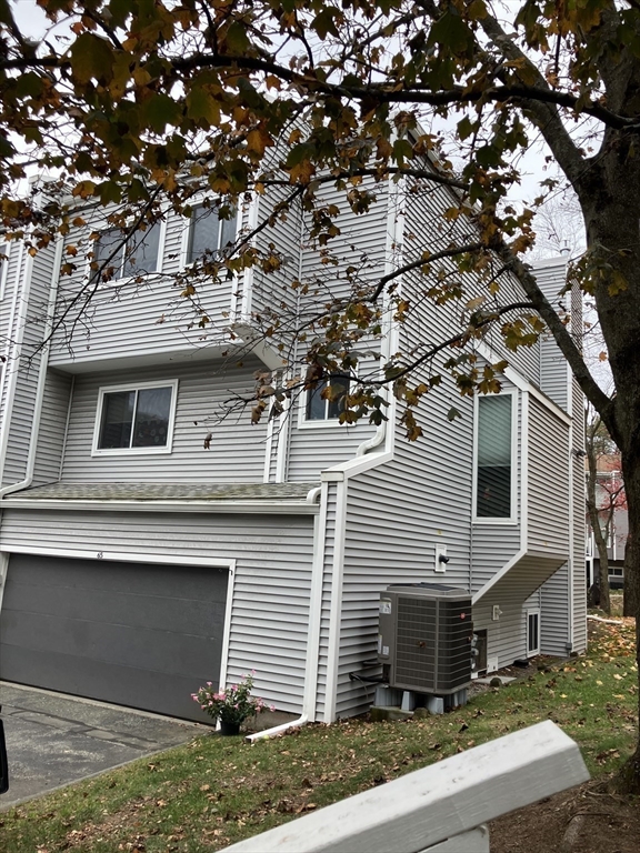 255 North Road, Unit 65 Chelmsford, MA 01824 - Photo 30 of 31 a view of a house with a tree