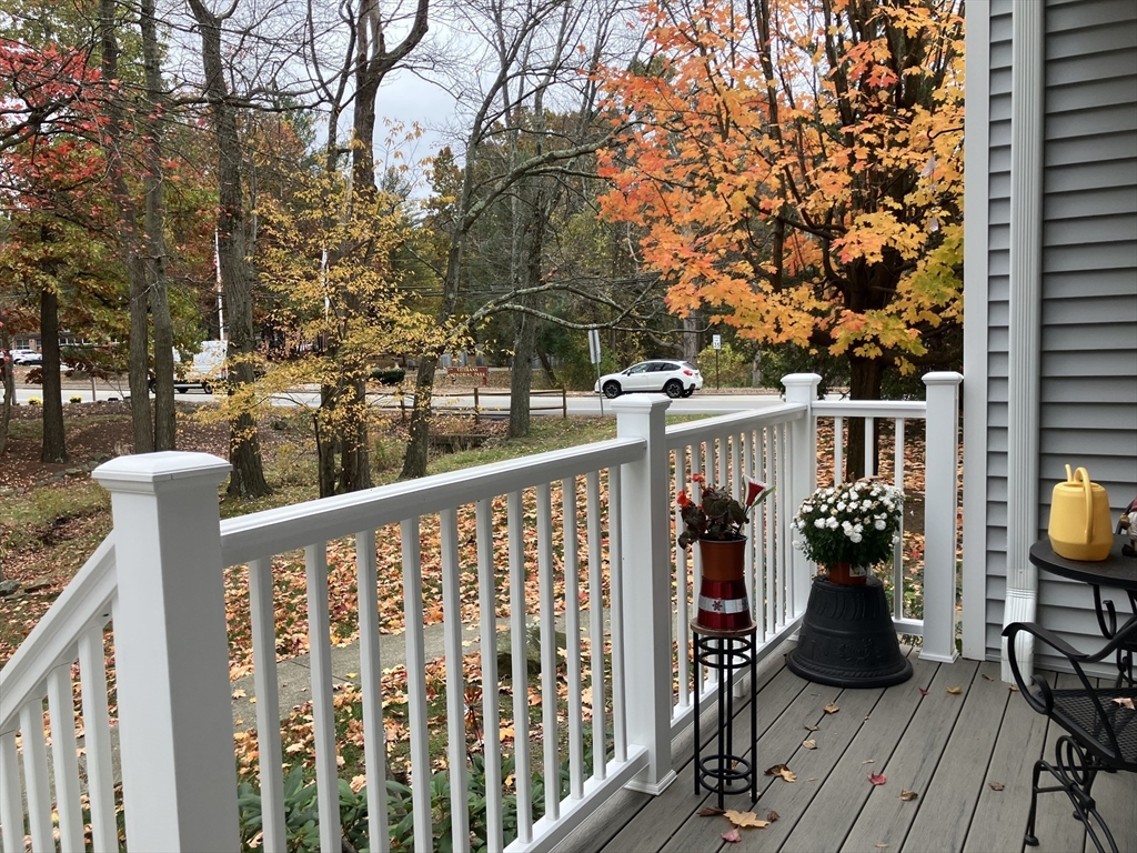 255 North Road, Unit 65 Chelmsford, MA 01824 - Photo 5 of 31 a view of a balcony with chairs