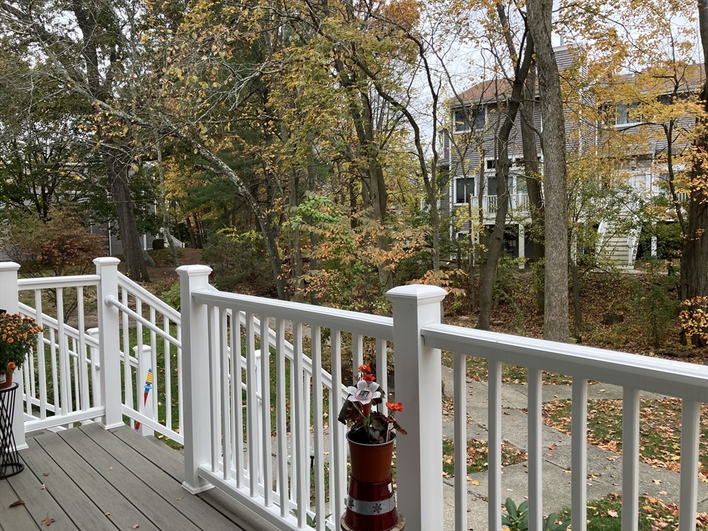255 North Road, Unit 65 Chelmsford, MA 01824 - Photo 7 of 31 a view of a balcony with yard