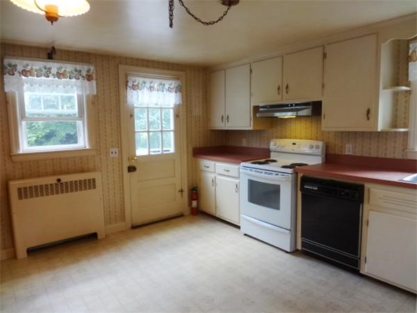 3 Girdler Road Marblehead, MA 01945 - Photo 3 of 8 a kitchen with stainless steel appliances a stove a sink and a microwave