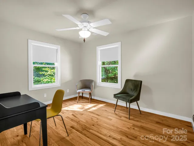 a workspace with furniture and a window