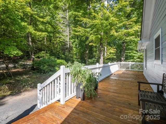 a view of a balcony with wooden floor