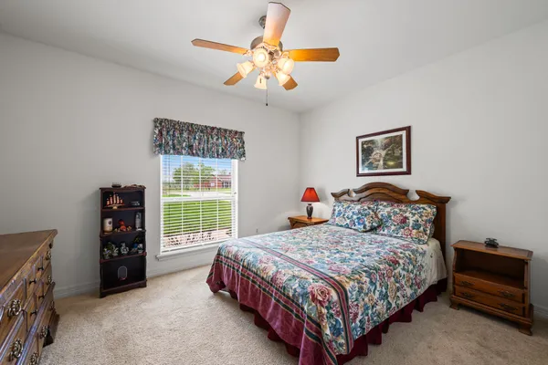 a bathroom with a double vanity sink a mirror and a shower