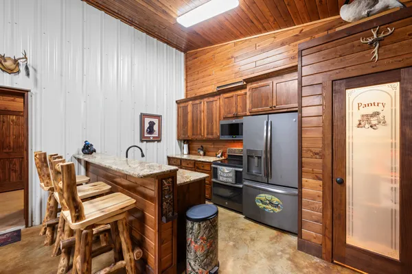 a view of hallway with seating area