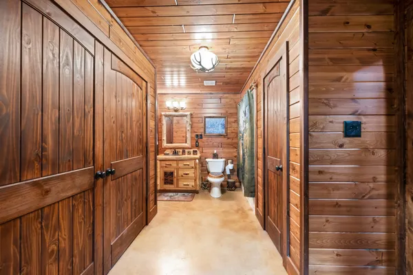 a bedroom with furniture and a flat screen tv