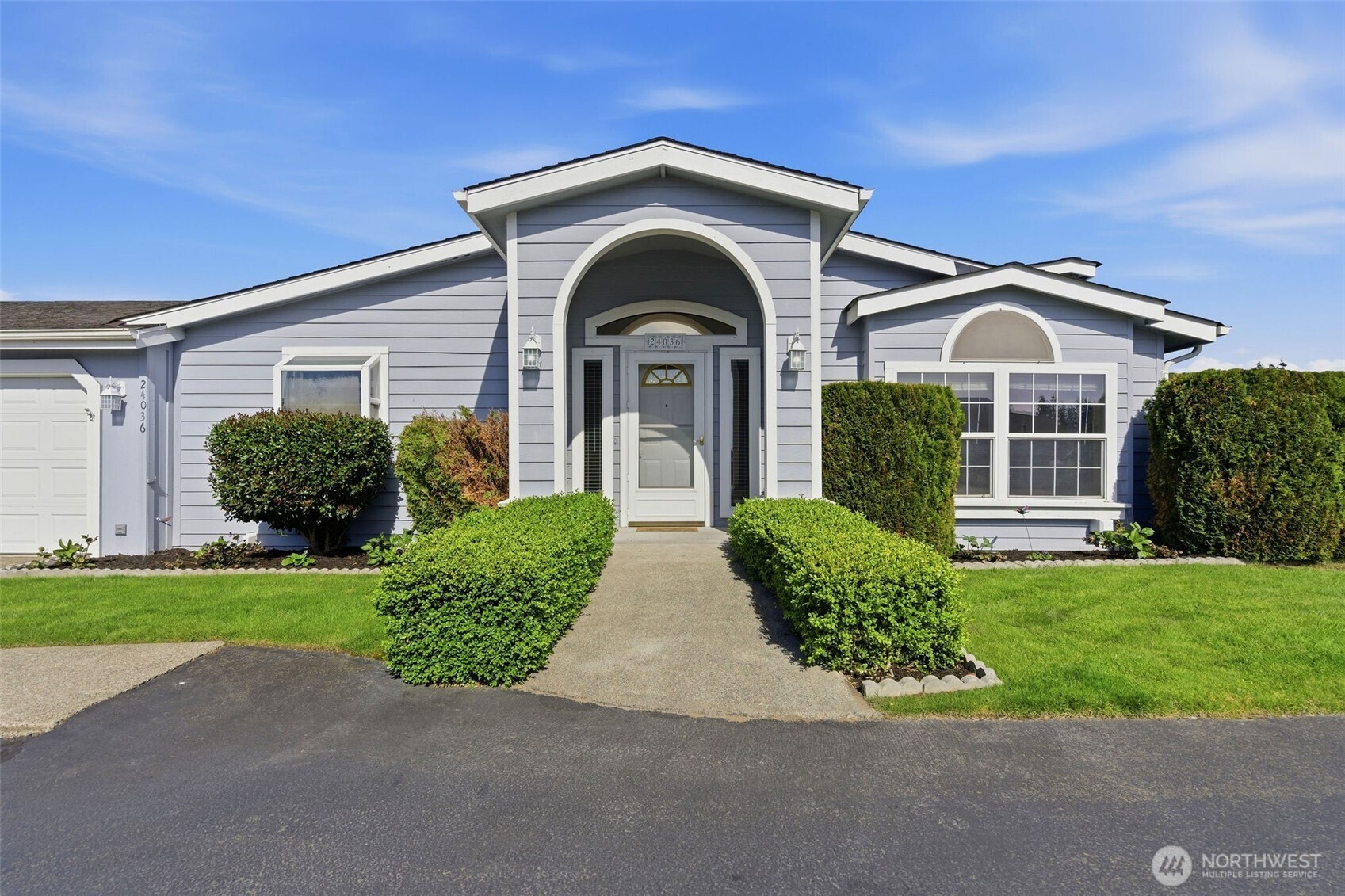 24036 222nd Avenue Southeast Maple Valley, WA 98038 - Photo 2 of 37 a front view of a house with garden
