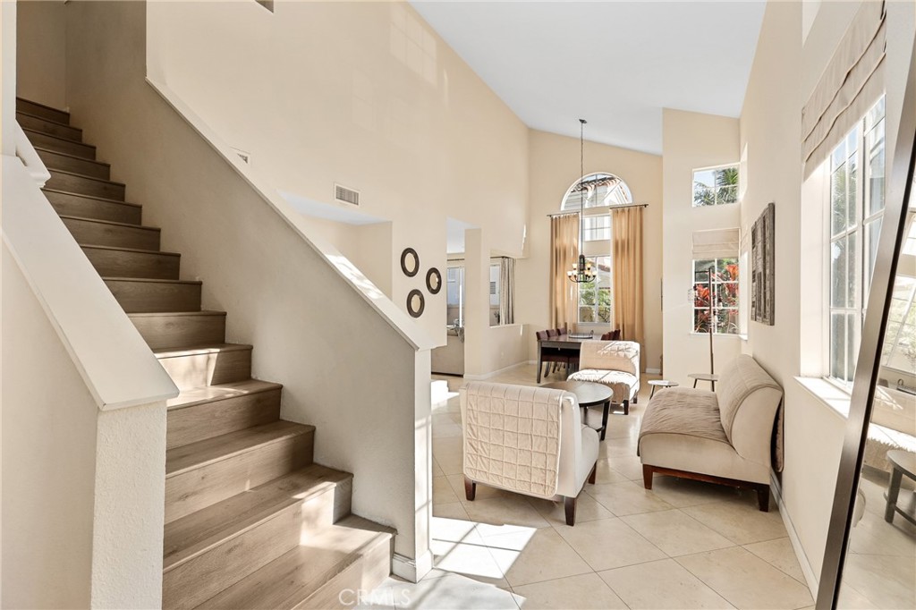 2 Bormes Irvine, CA 92614 - Photo 22 of 69 a living room with furniture and a chandelier