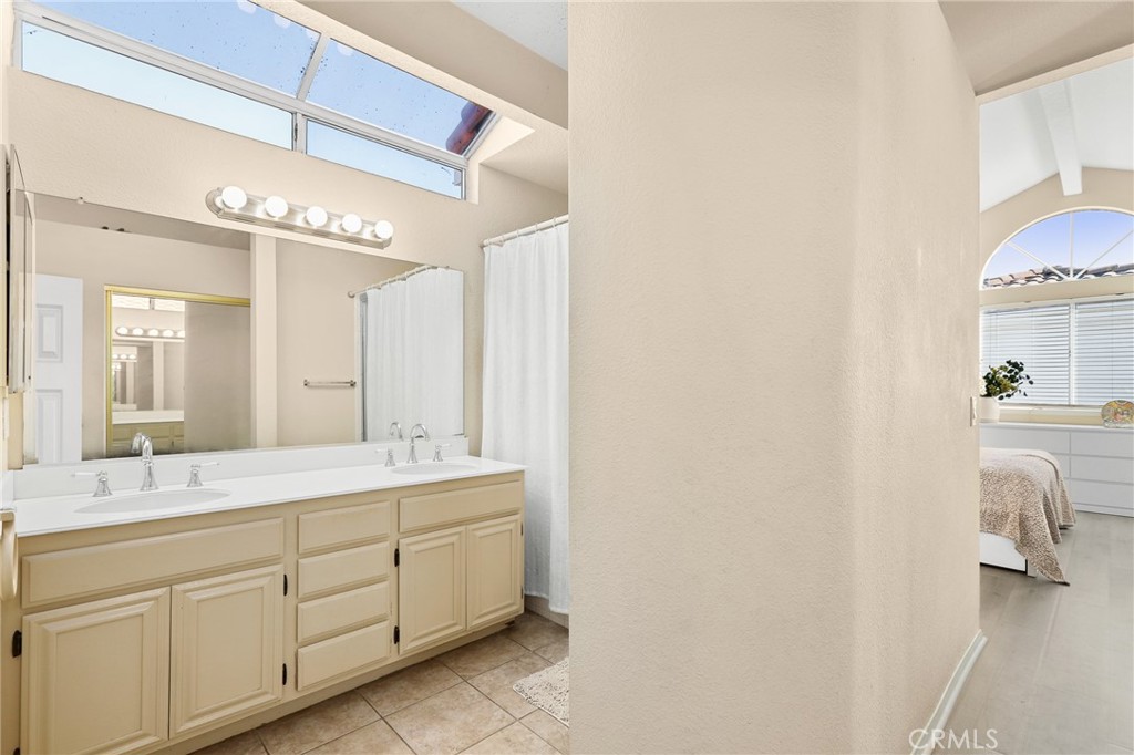 2 Bormes Irvine, CA 92614 - Photo 28 of 69 a spacious bathroom with a double vanity sink and a mirror